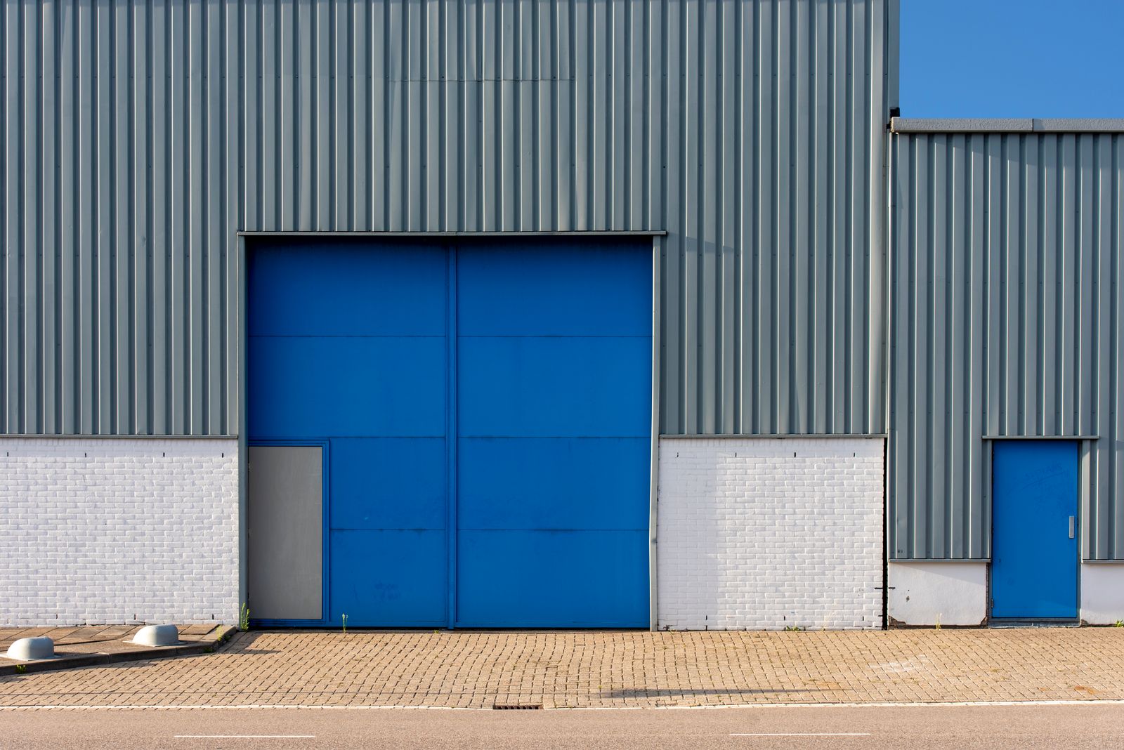 Metal warehouse building with loading doors